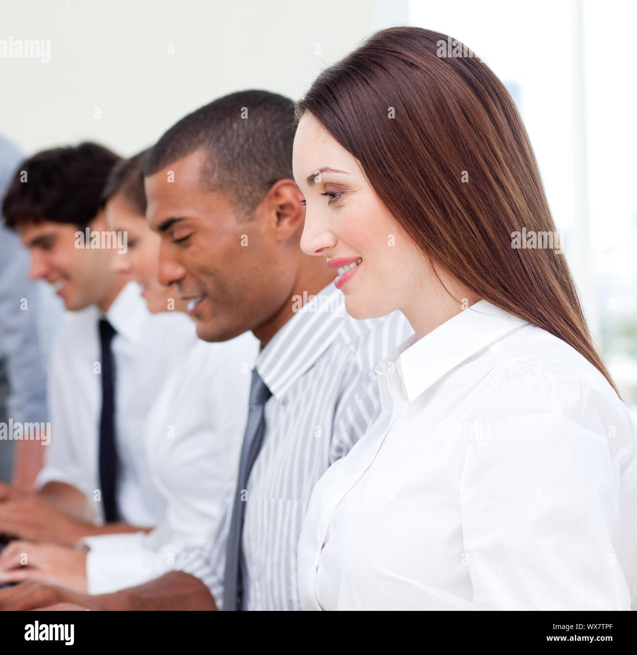 Successful business team at work in the office Stock Photo - Alamy