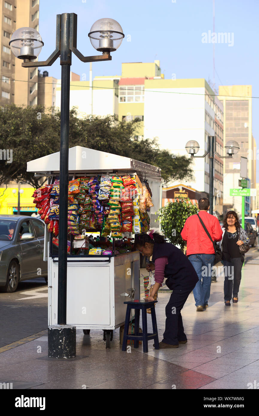 LIMA, PERU - SEPTEMBER 13, 2011: Unidentified street vendor selling sweets, small snacks and drinks on September 13, 2011 in Miraflores, Lima, Peru Stock Photo