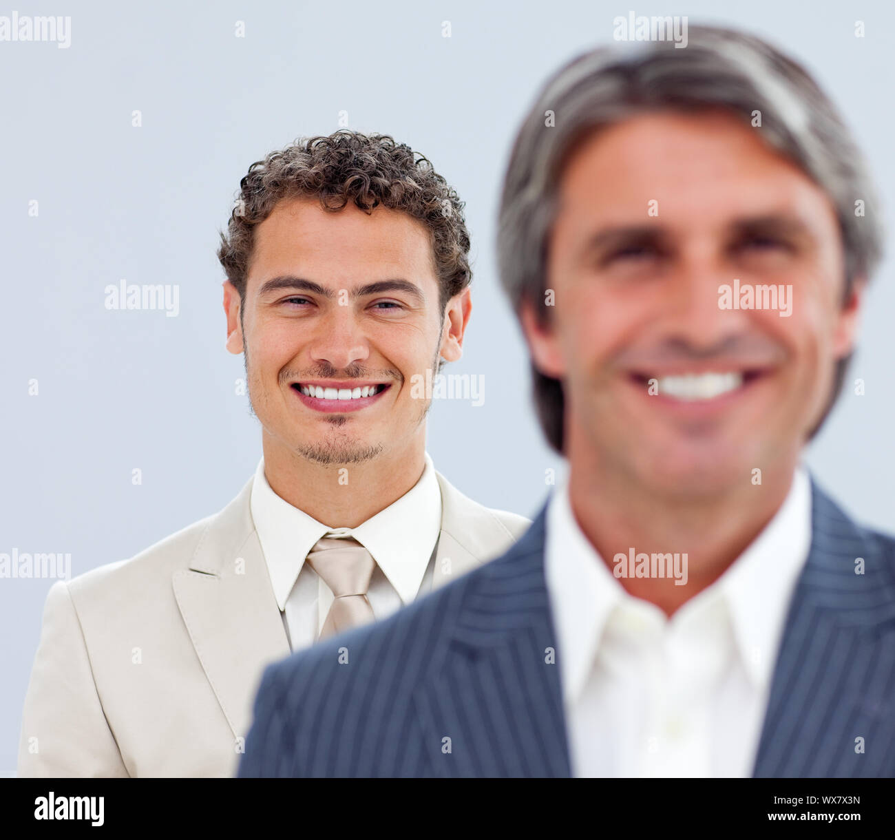 Portrait of two charming businessmen standing Stock Photo - Alamy