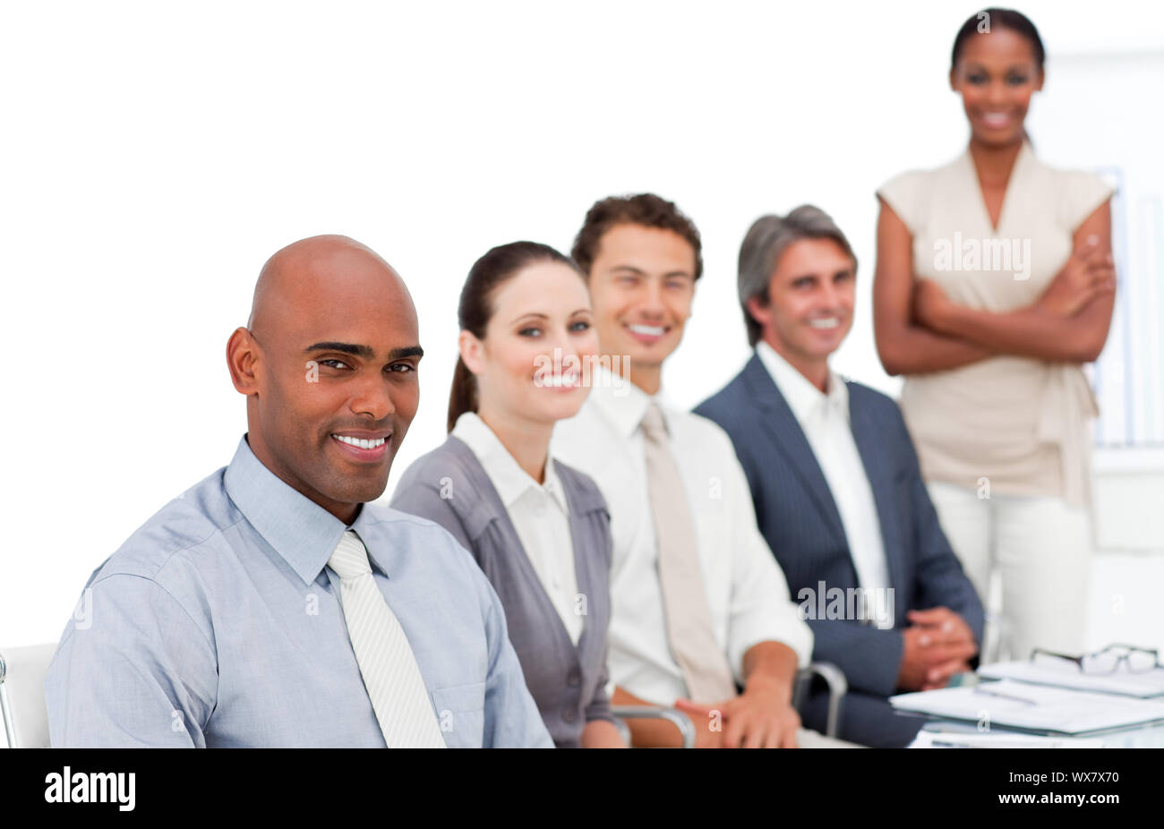 Self-assured multi-ethnic business group at a presentation in the office Stock Photo