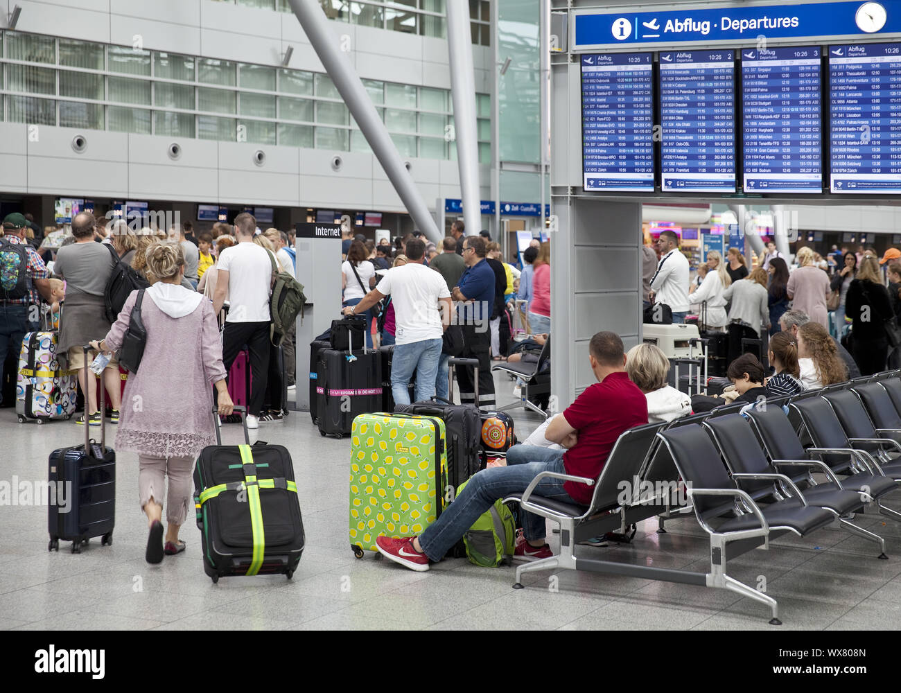 airport terminal with many people during the holliday season, Duesseldorf, Germany, Europe Stock Photo