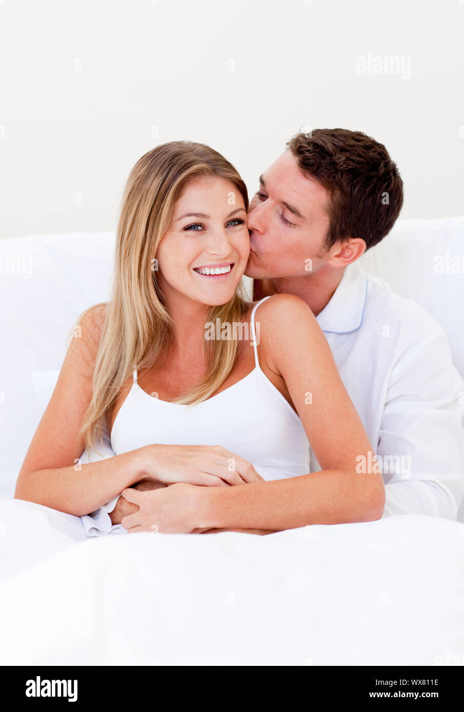 Attentive man kissing wife hires stock photography and images Alamy