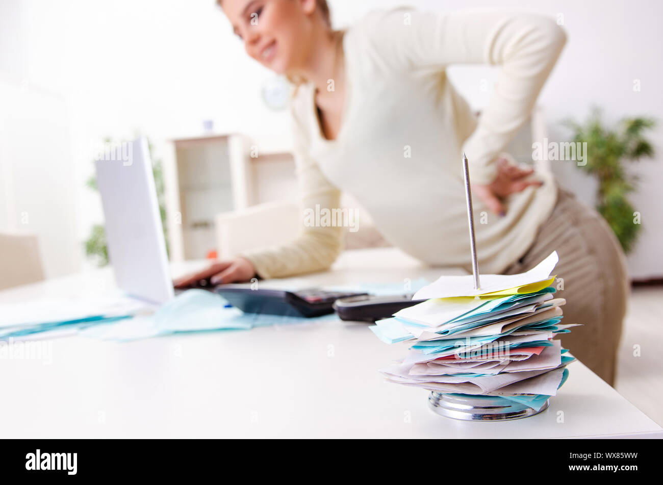 Picture of Young pregnant woman in budget planning concept Stock Photo - Alamy