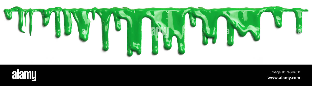 Green slime like paint dripping isolated on white Stock Photo