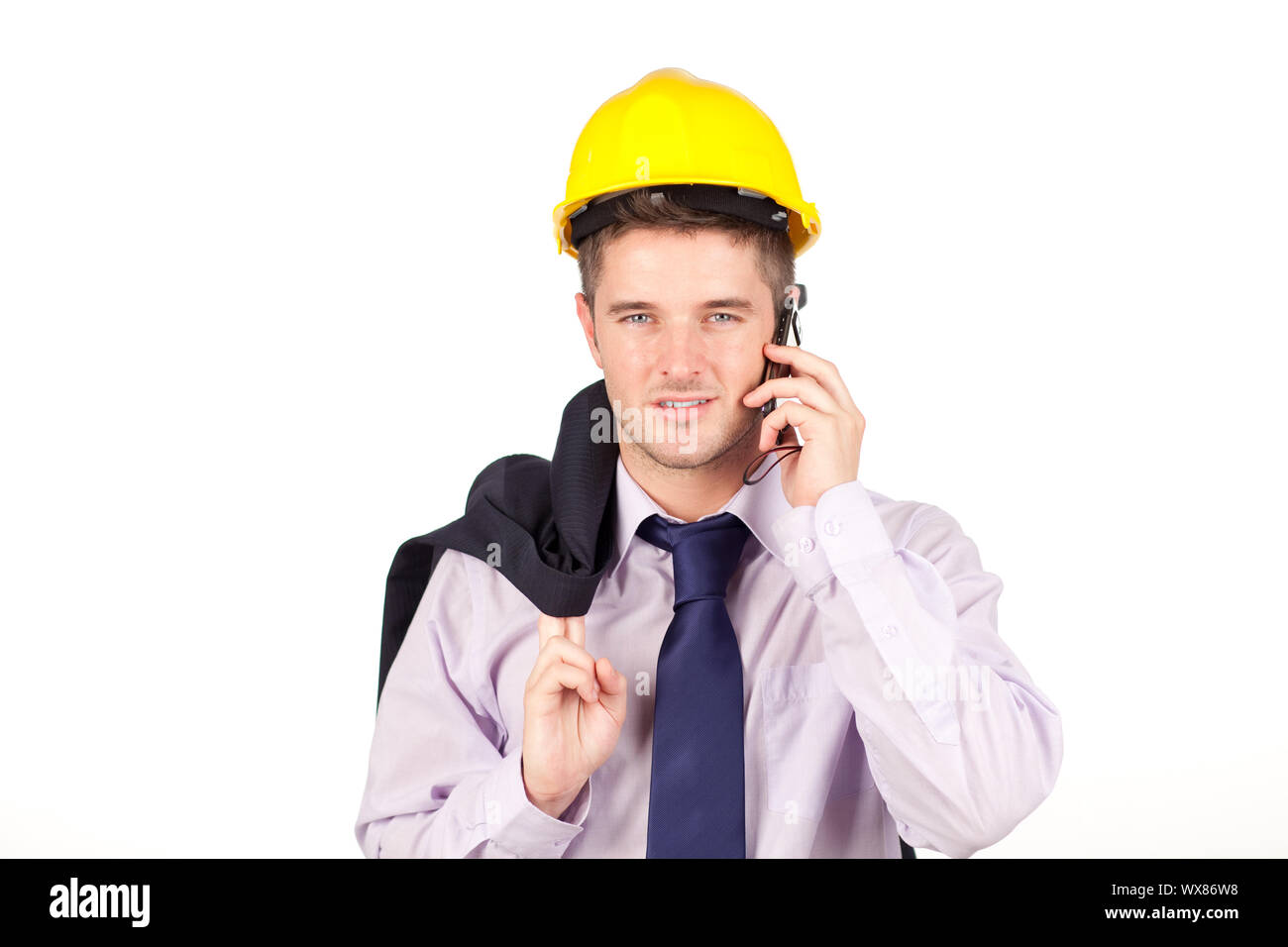 Young Construction worker talking on the phone Stock Photo