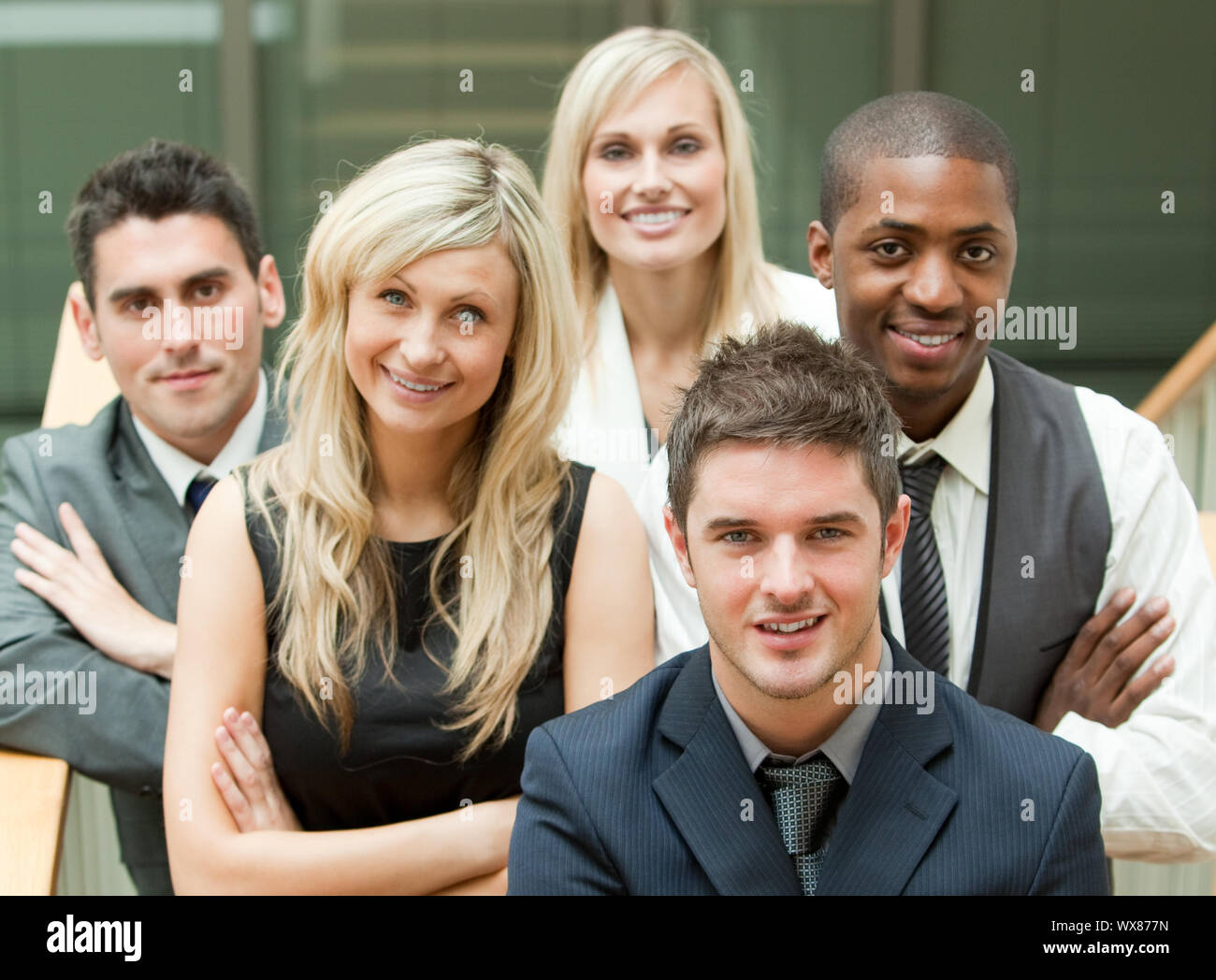Businesspeople in a stairs with the leader in the middle Stock Photo