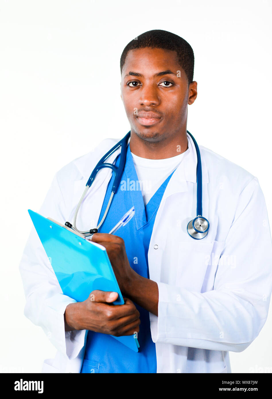 Serious Afro-American doctor holding a clipboard and looking at the camera Stock Photo