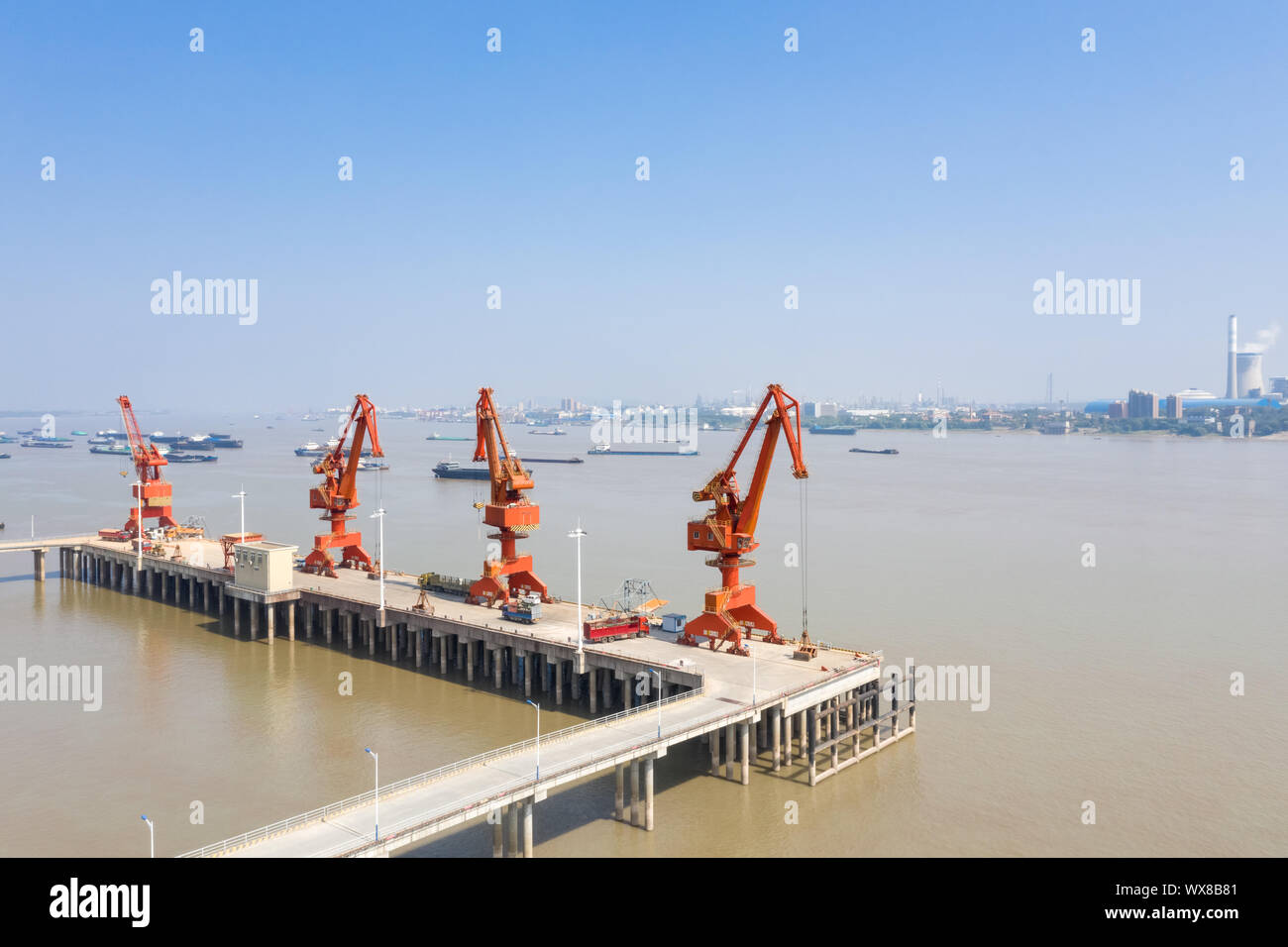 a row of pier cranes Stock Photo