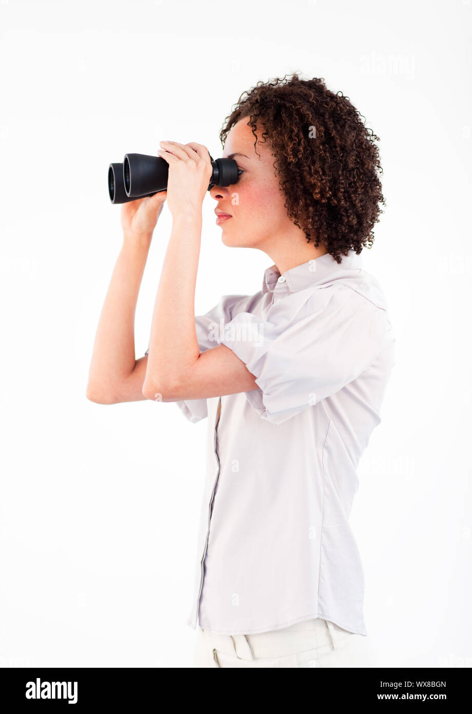 Successful Ethnic businesswoman with binoculars Stock Photo