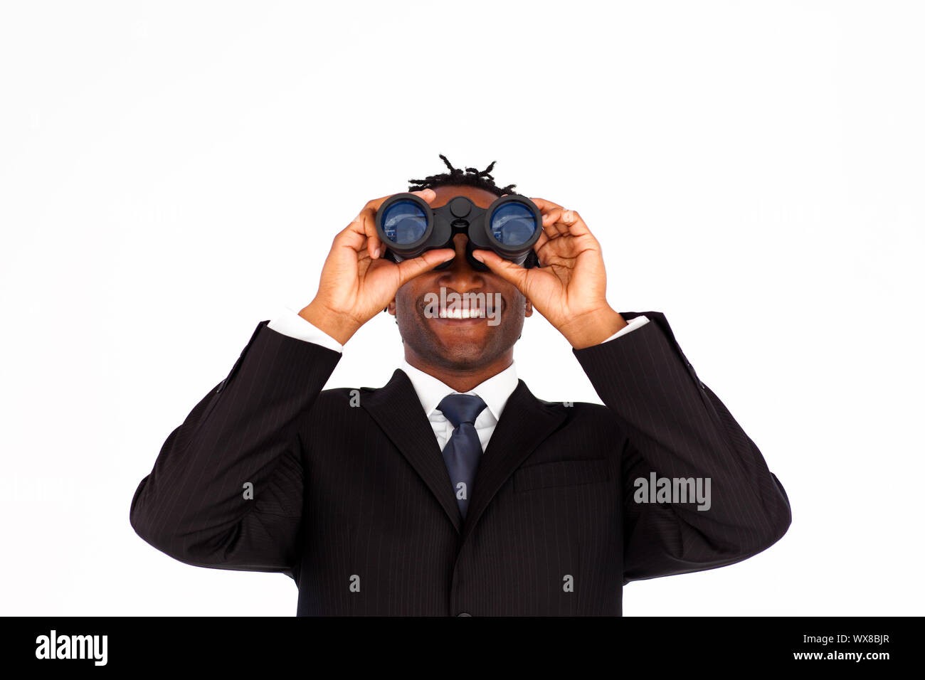 Close-up of a charming businessman looking through binoculars Stock Photo