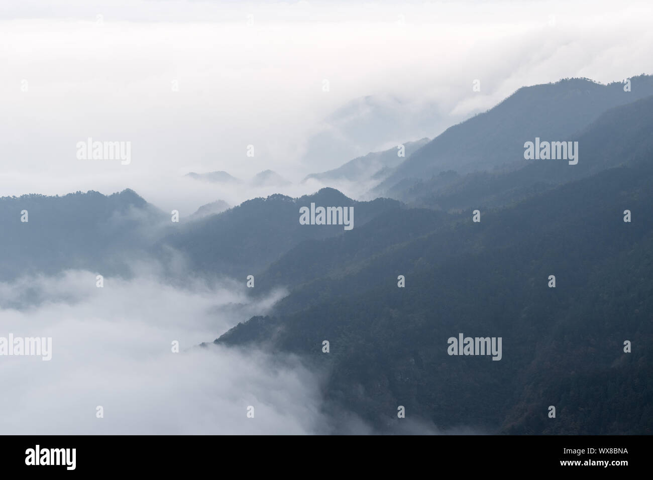 clouds and mists drifting in the valley Stock Photo