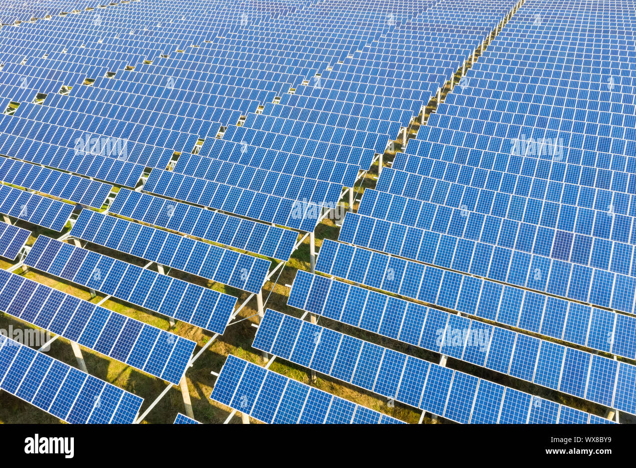 arrays of blue solar panels on photovoltaic power station Stock Photo