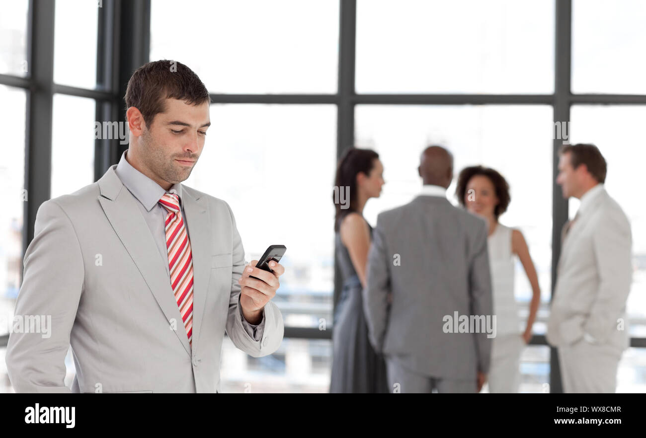 Smiling businessman with his team Stock Photo
