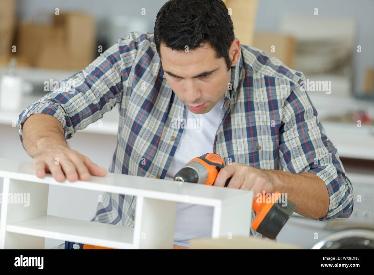 drilling the holes in furniture Stock Photo