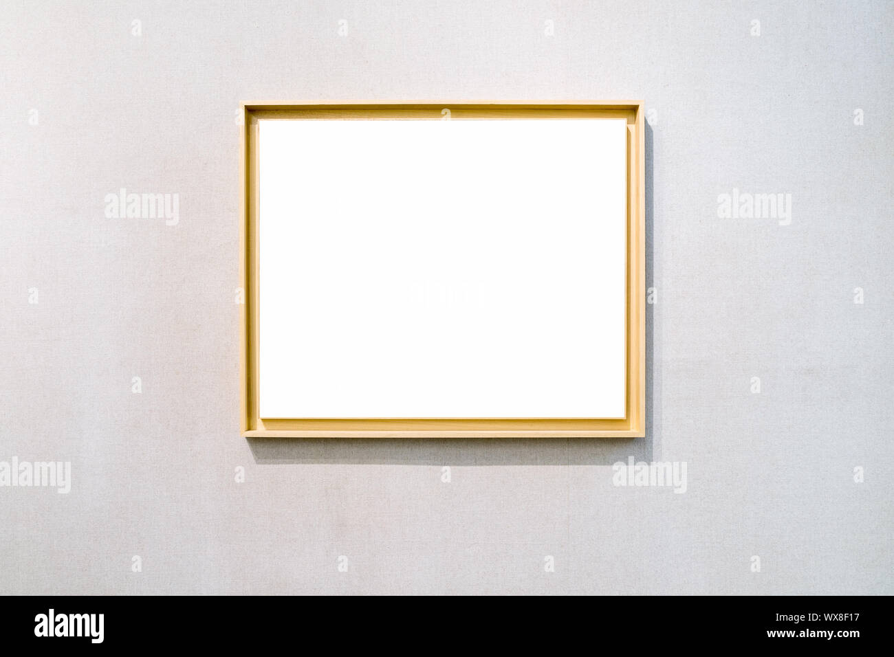 blank picture frame on exhibition wall Stock Photo