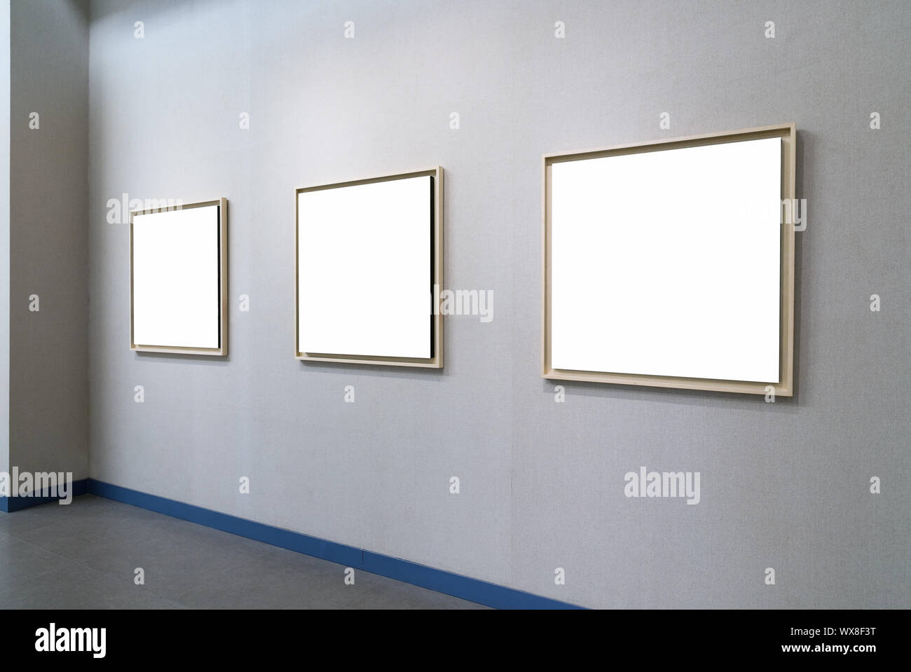 blank picture frames on exhibition wall Stock Photo