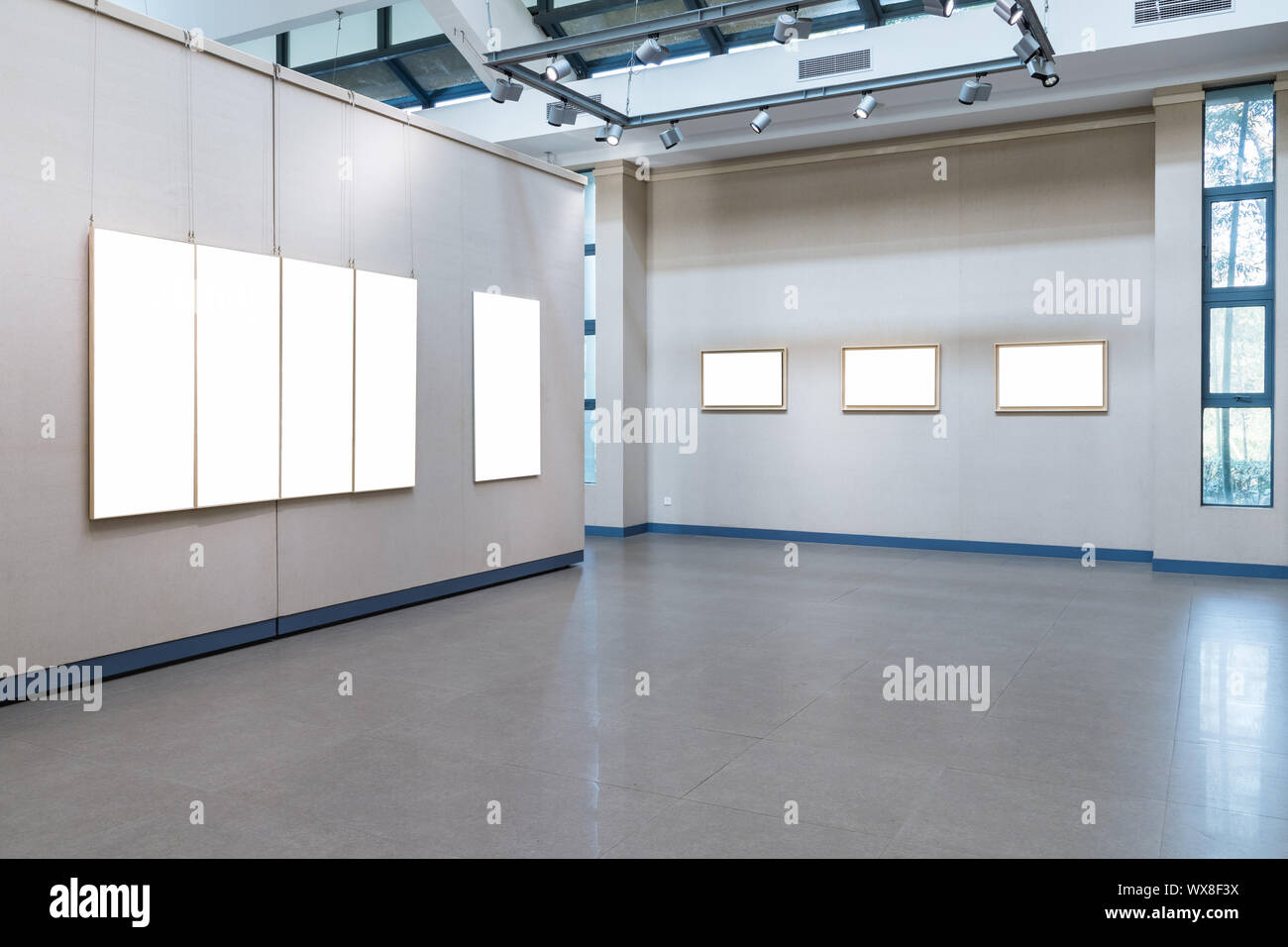 blank picture frames on exhibition wall Stock Photo