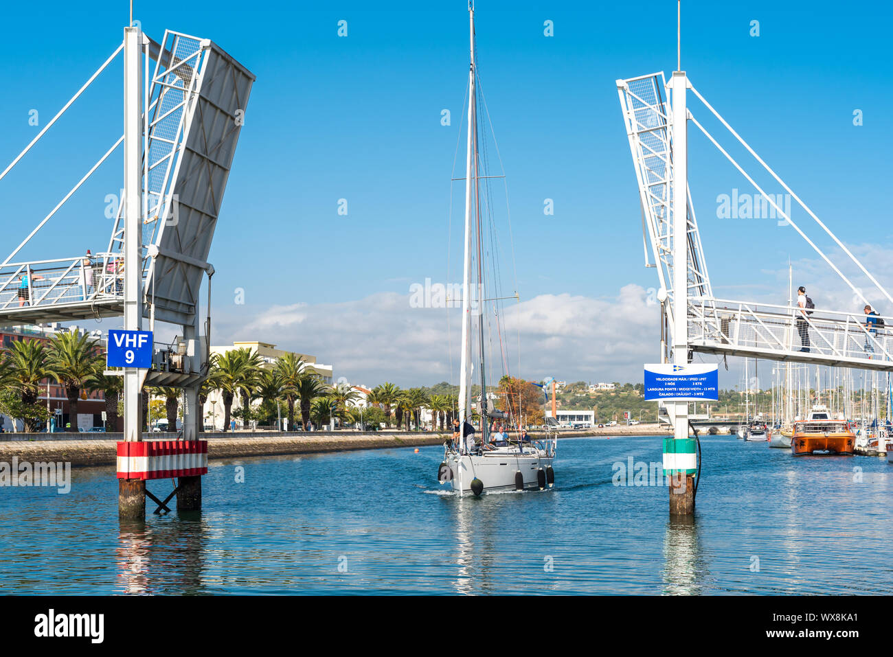 The Footbridge to the marina Lagos is as a modern drawbridge a landmark in the port Stock Photo