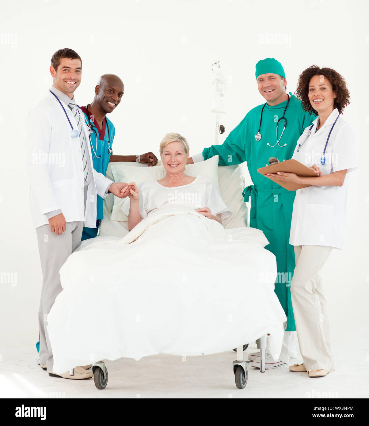 Group of doctors attending to a patient in a hospital Stock Photo Alamy