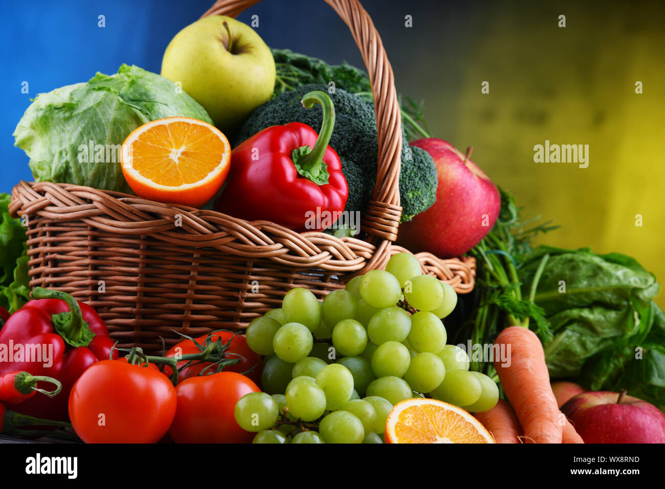 Fresh organic fruits and vegetables in wicker basket Stock Photo - Alamy