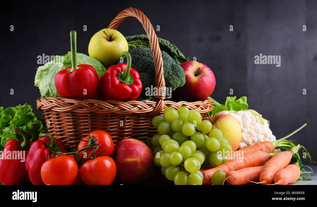 Fresh organic fruits and vegetables in wicker basket Stock Photo - Alamy