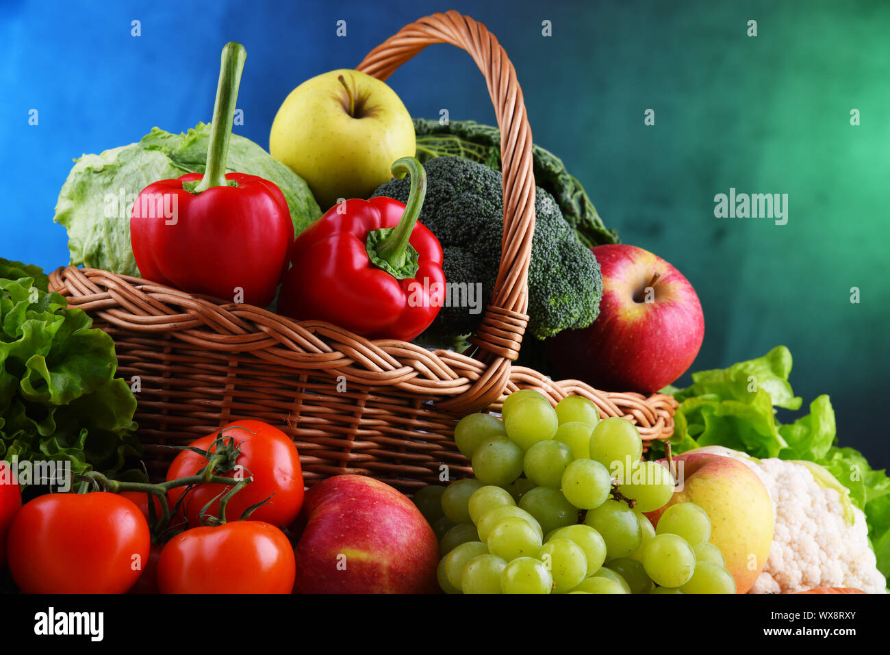 Fresh organic fruits and vegetables in wicker basket Stock Photo - Alamy