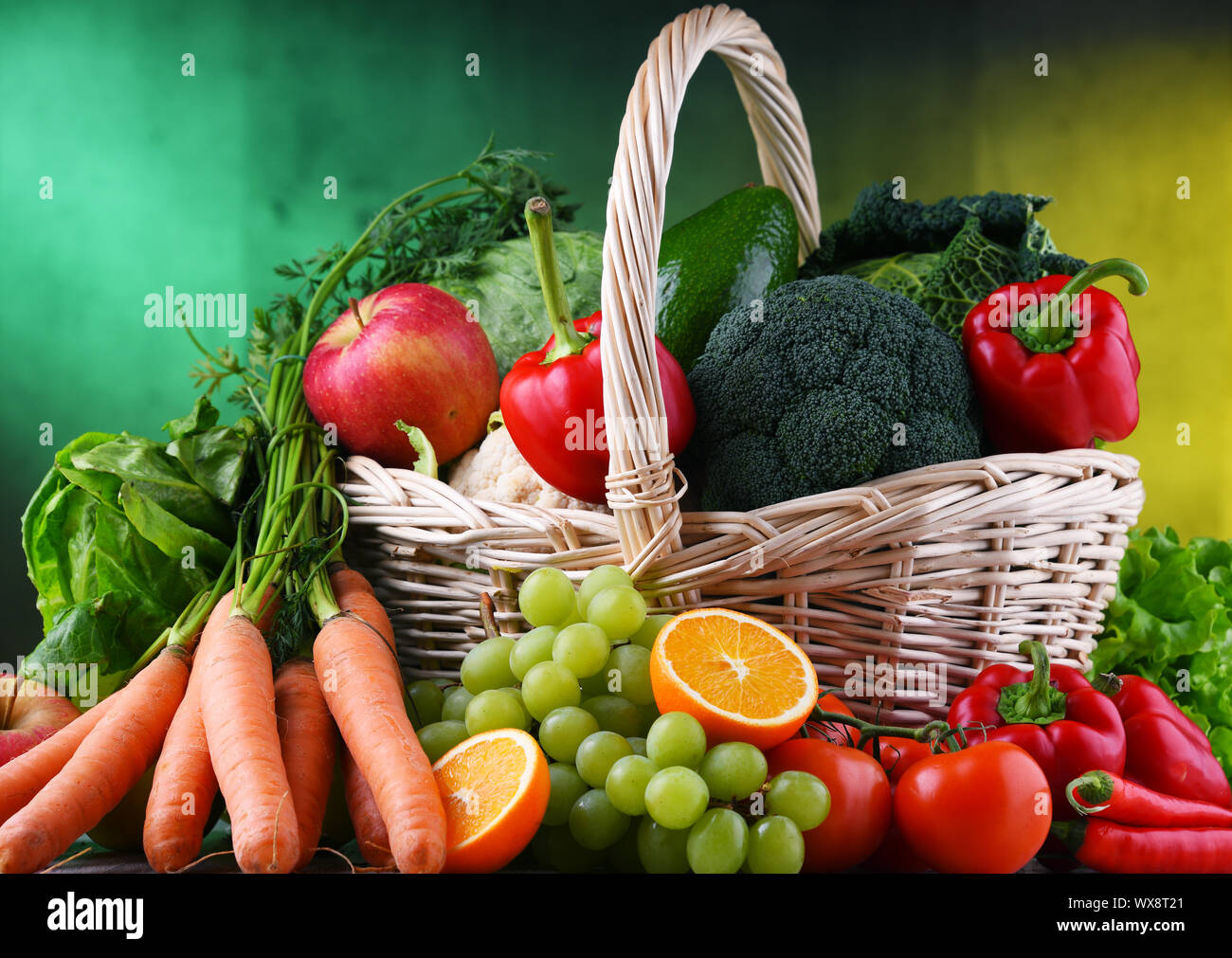 Fresh organic fruits and vegetables in wicker basket Stock Photo - Alamy