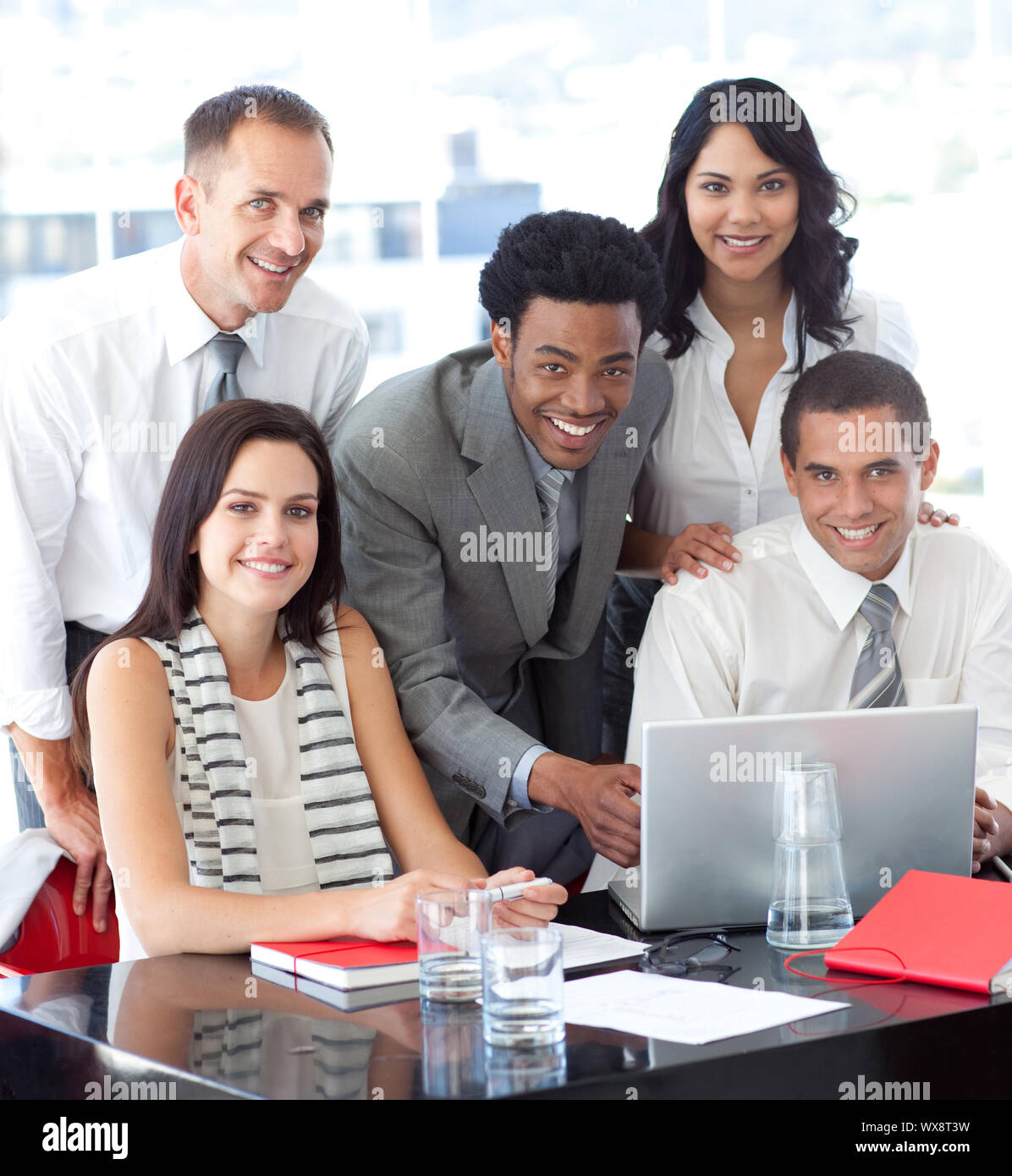Happy multi-ethnic business team working together in office Stock Photo ...