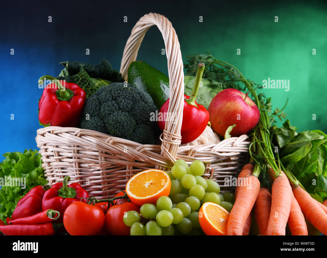 Fresh organic fruits and vegetables in wicker basket Stock Photo - Alamy