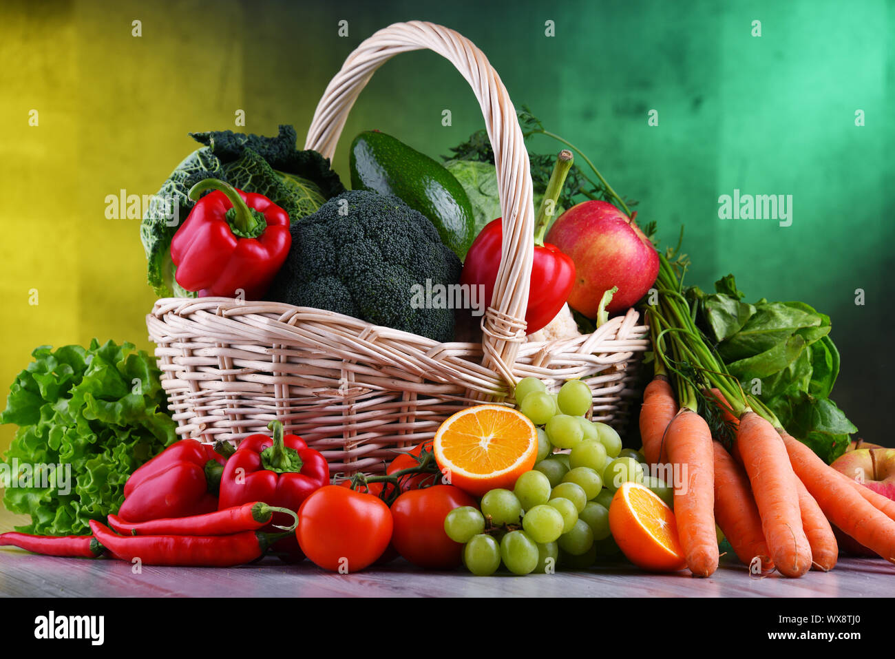 Fresh organic fruits and vegetables in wicker basket Stock Photo - Alamy