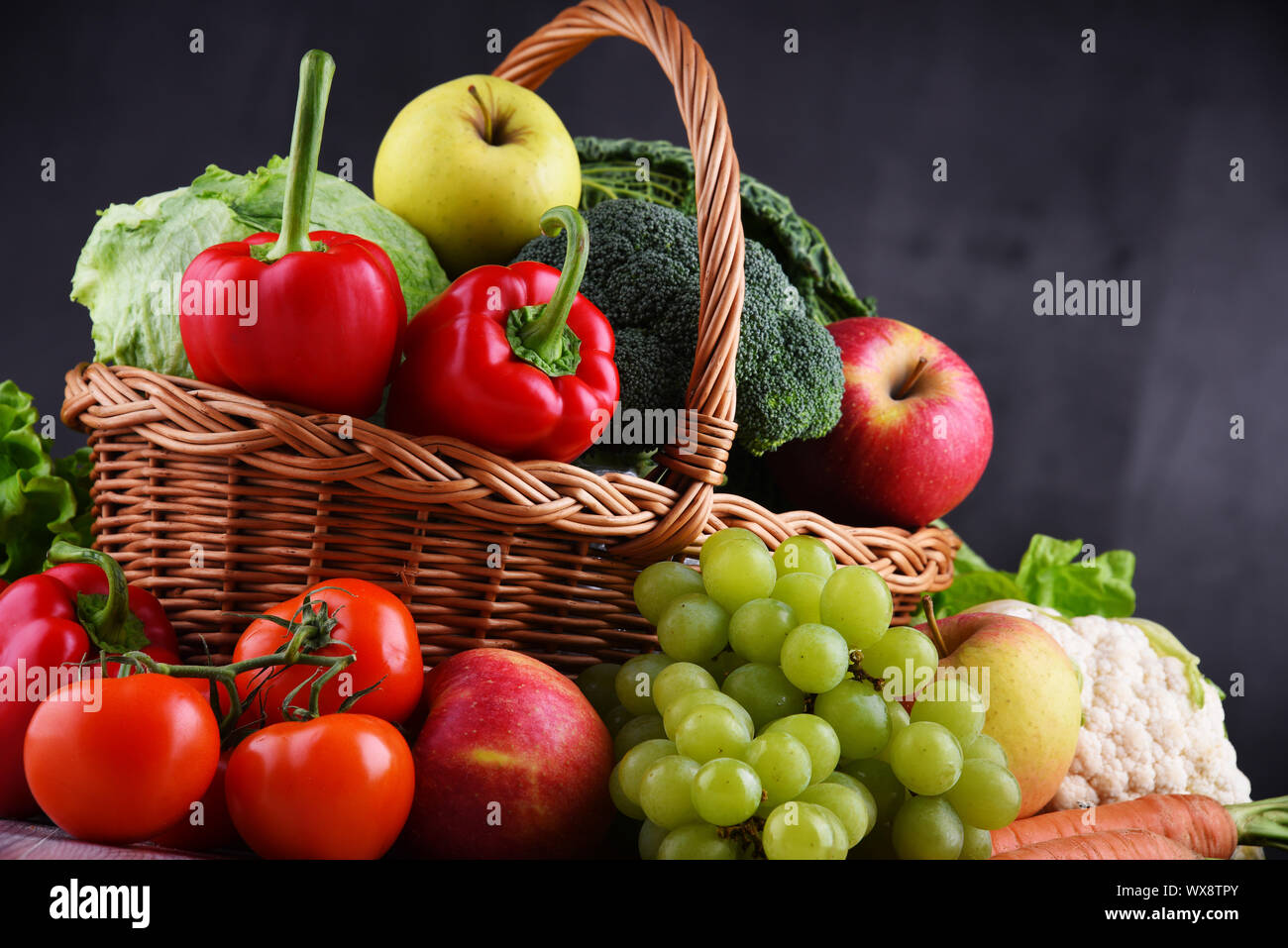 Fresh organic fruits and vegetables in wicker basket Stock Photo - Alamy