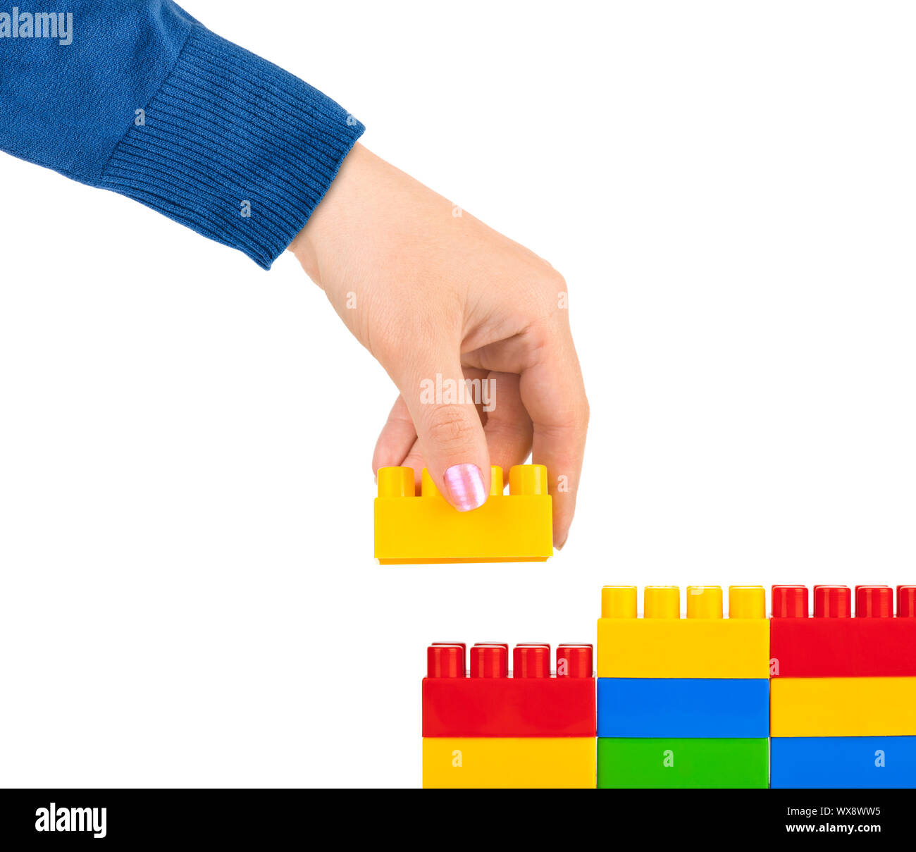 Hand and toy wall Stock Photo