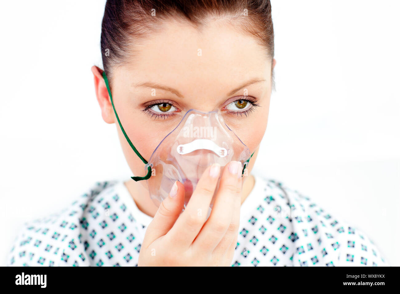 Female patient with an oxygen mask against a white background Stock ...