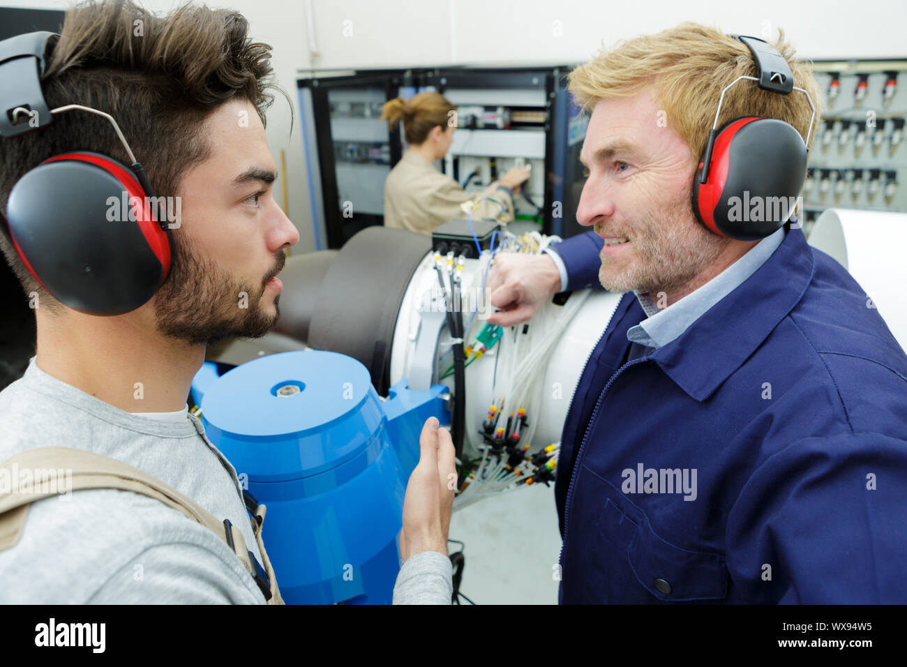 Engineering Connect Images network engineers connect a machine Stock Photo - Alamy