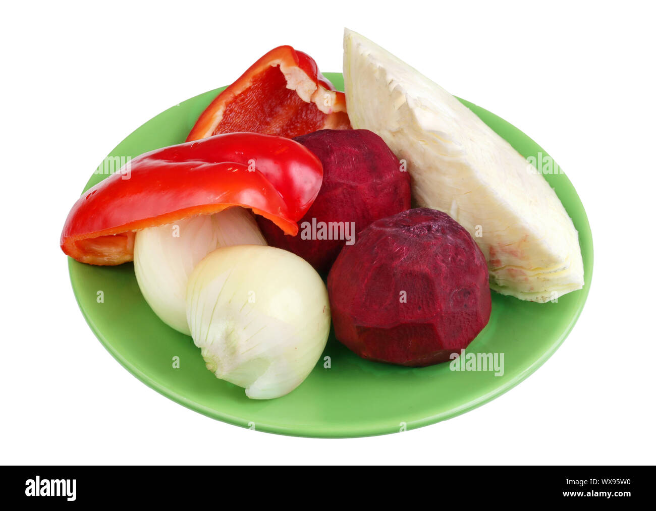 Vegetables soup borscht on a green plate isolated Stock Photo