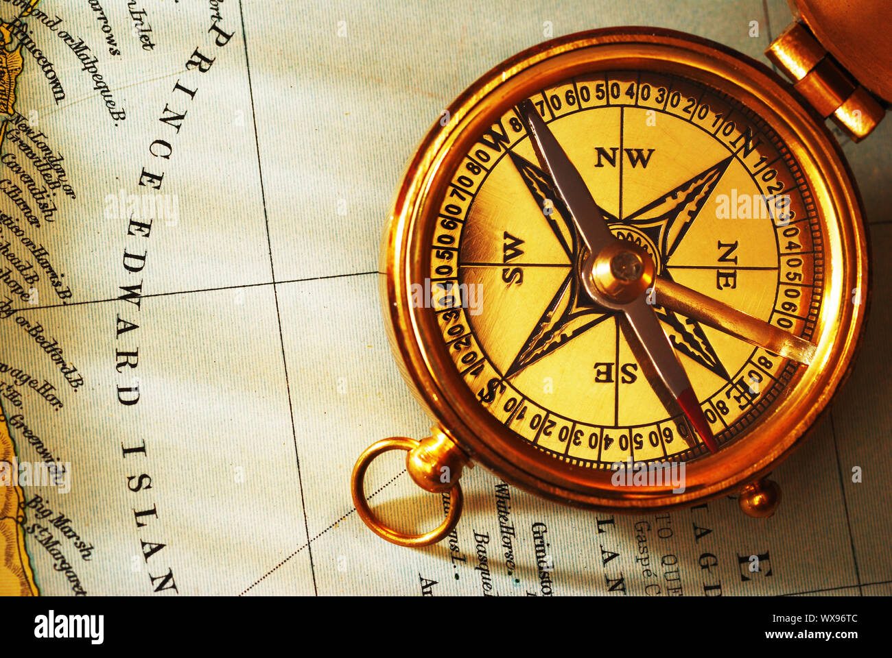 Antique brass compass over old Canadian map background Stock Photo - Alamy