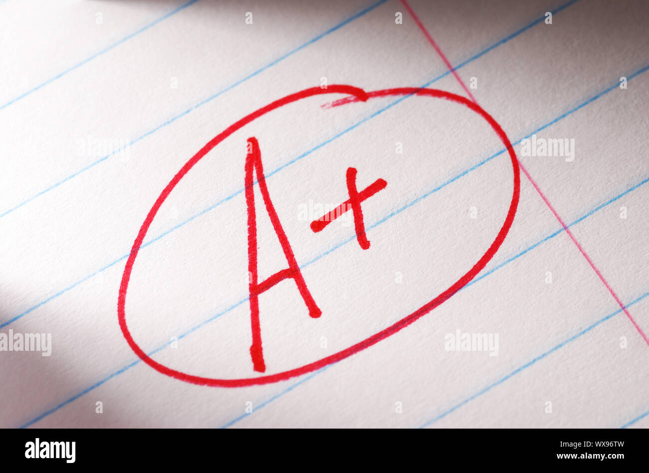 A plus grade in the notebook Stock Photo - Alamy
