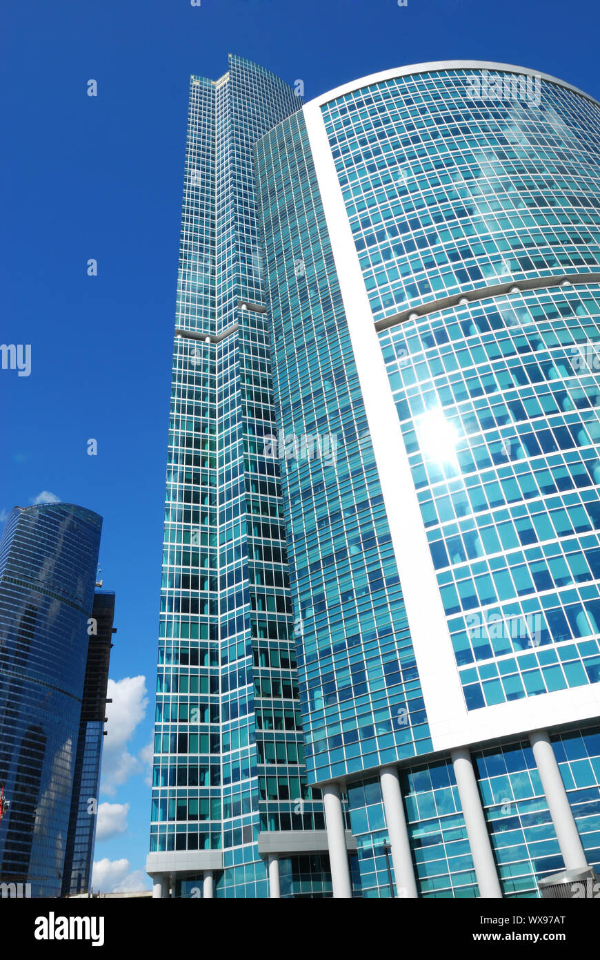 Modern office building with sky reflection in windows Stock Photo - Alamy