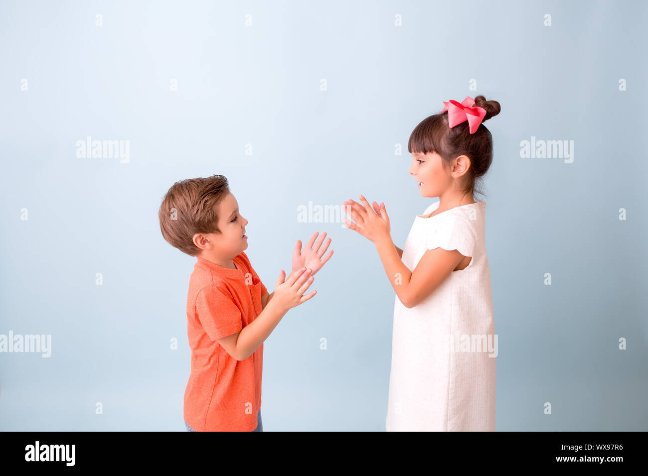 Kids playing hand clapping games Stock Photo Alamy