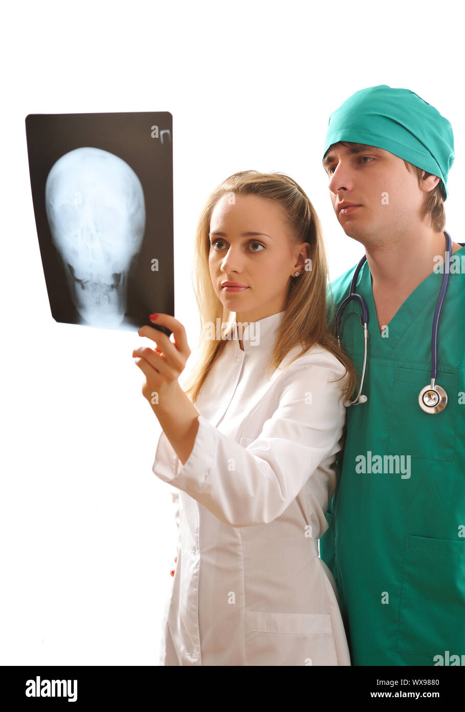 Doctors looking at x-ray (isolated on white Stock Photo - Alamy