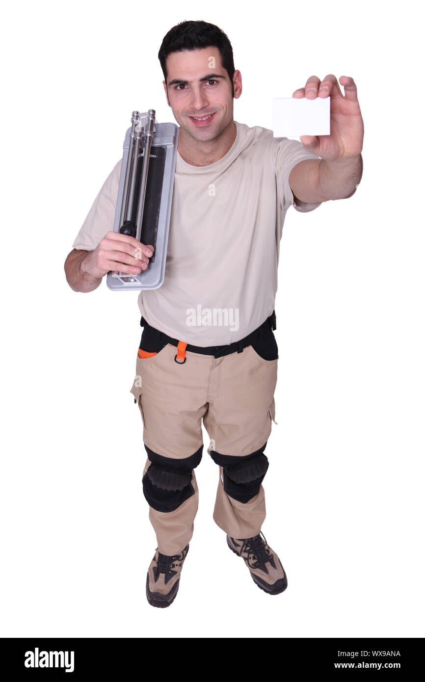 craftsman holding a business card Stock Photo Alamy