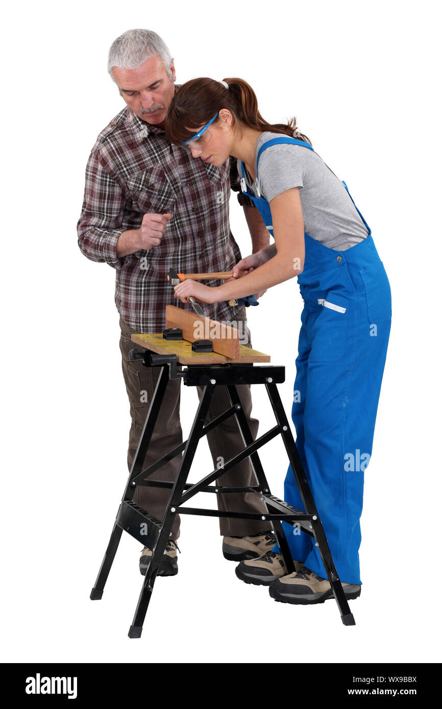 Man and woman doing carpentry work Stock Photo