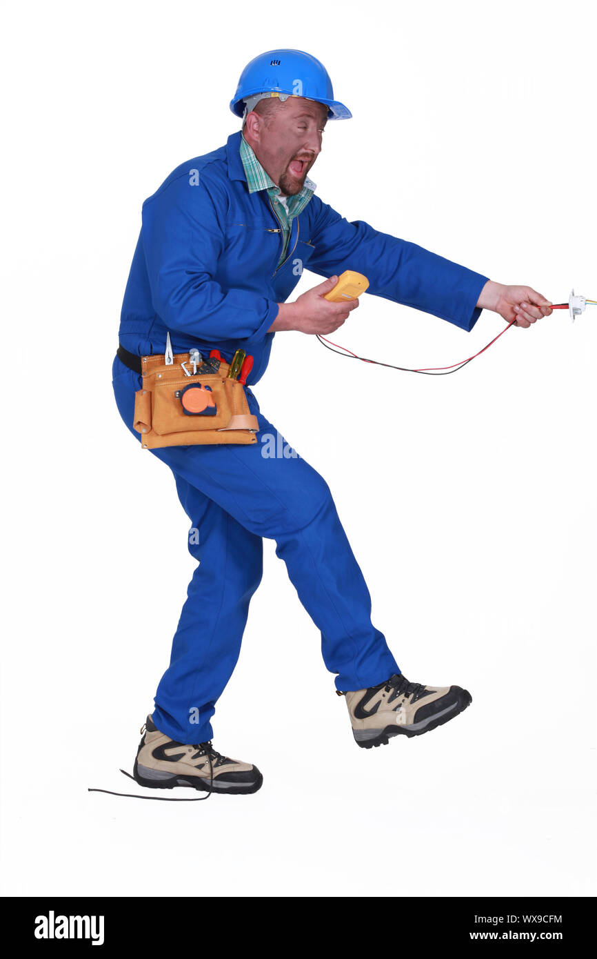 electrician having an accident Stock Photo