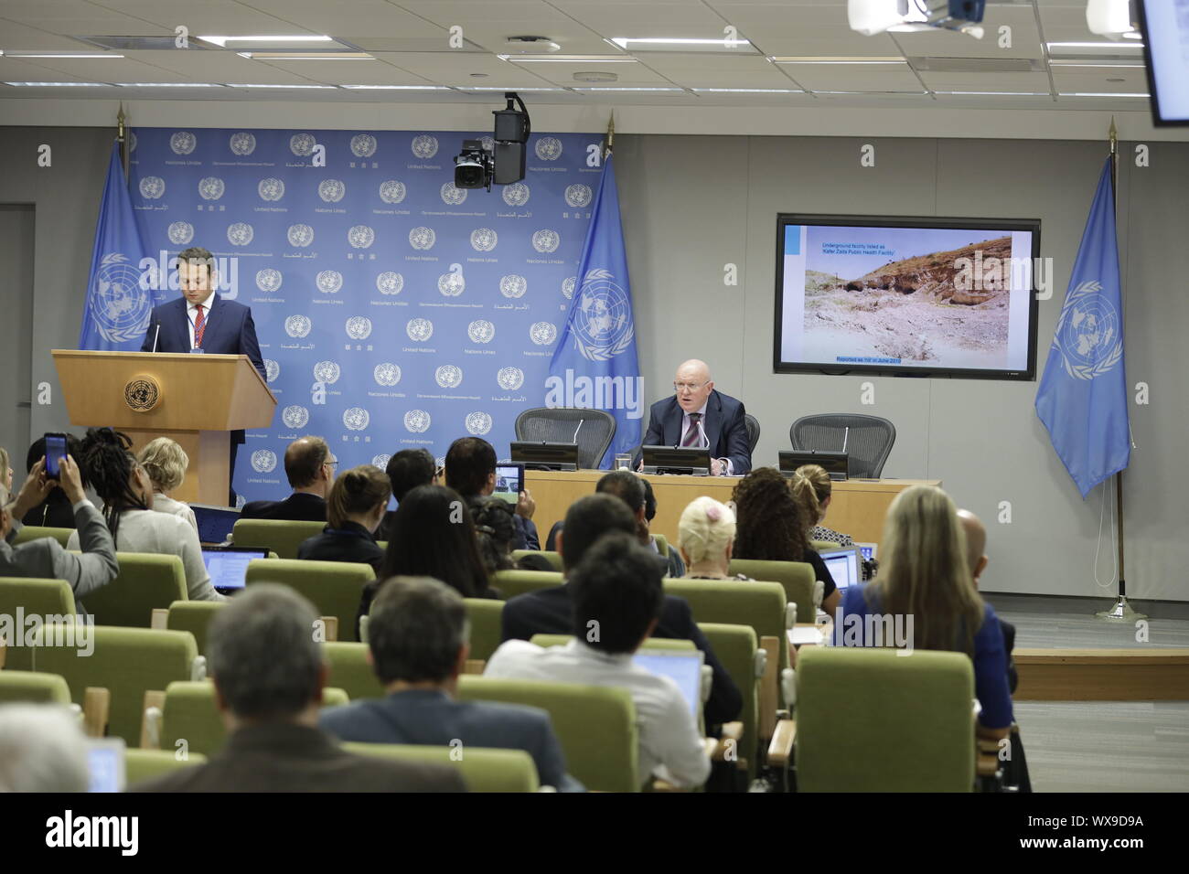 United Nations, UN headquarters in New York. 16th Sep, 2019. Vassily Nebenzia (R, Rear), Russian permanent representative to the United Nations and president of the UN Security Council for the month of September, speaks to journalists during a press conference on the situation in Syria, at the UN headquarters in New York, on Sept. 16, 2019. Russia's UN envoy said Monday that the latest ceasefire for Syria's Idlib has been breached by Jihadist rebels. Credit: Li Muzi/Xinhua/Alamy Live News Stock Photo