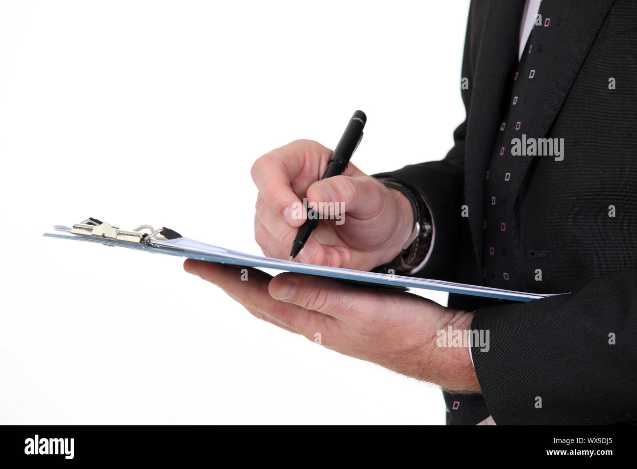 Writing on a clipboard Stock Photo