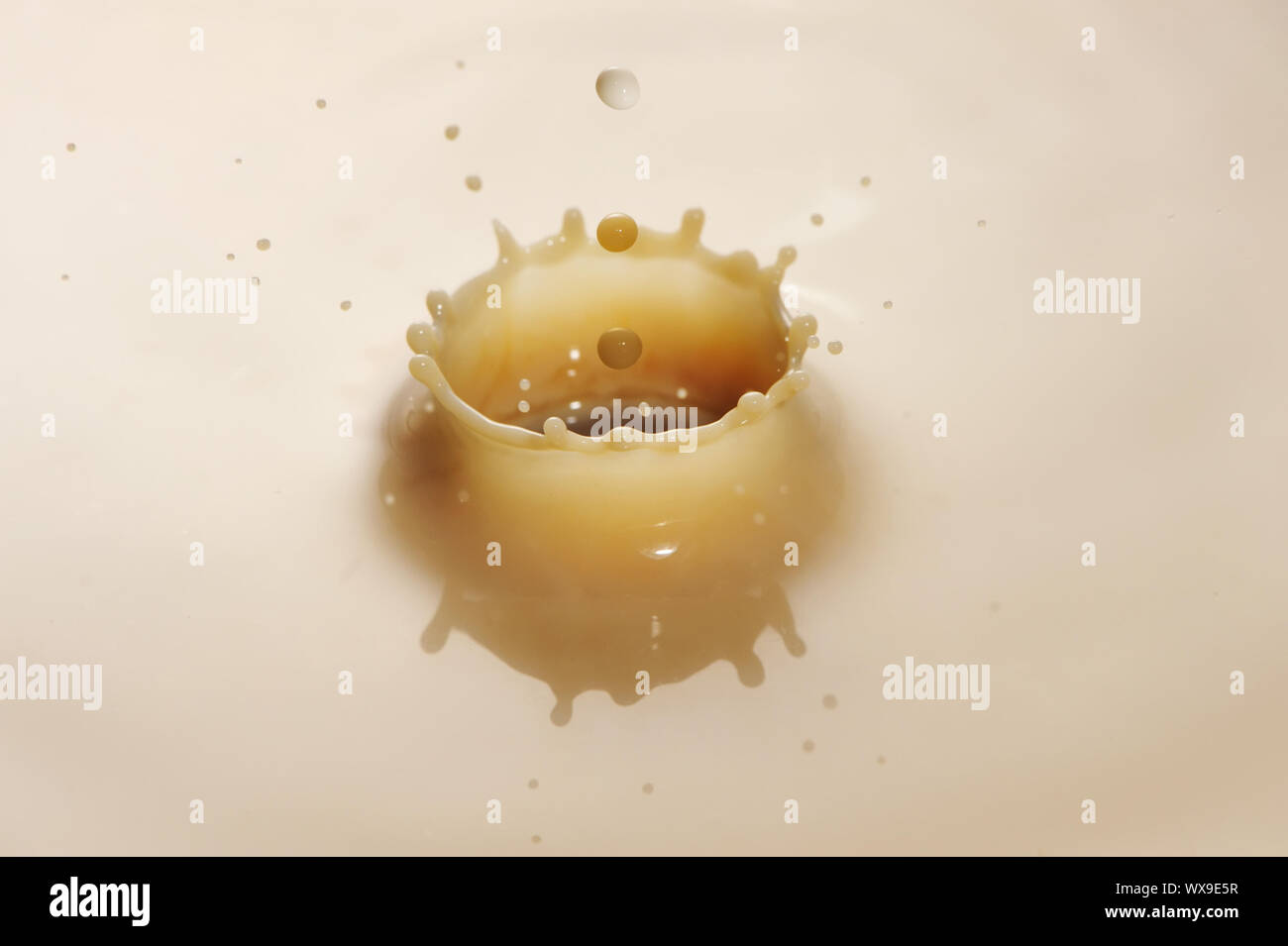 Coffee drop ripple in milk Stock Photo - Alamy