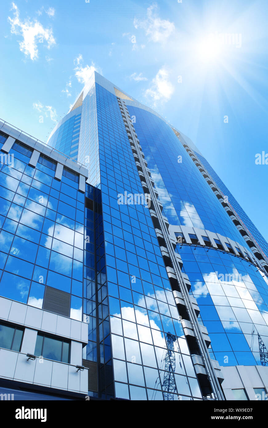 Modern office building with sky reflection in windows Stock Photo - Alamy