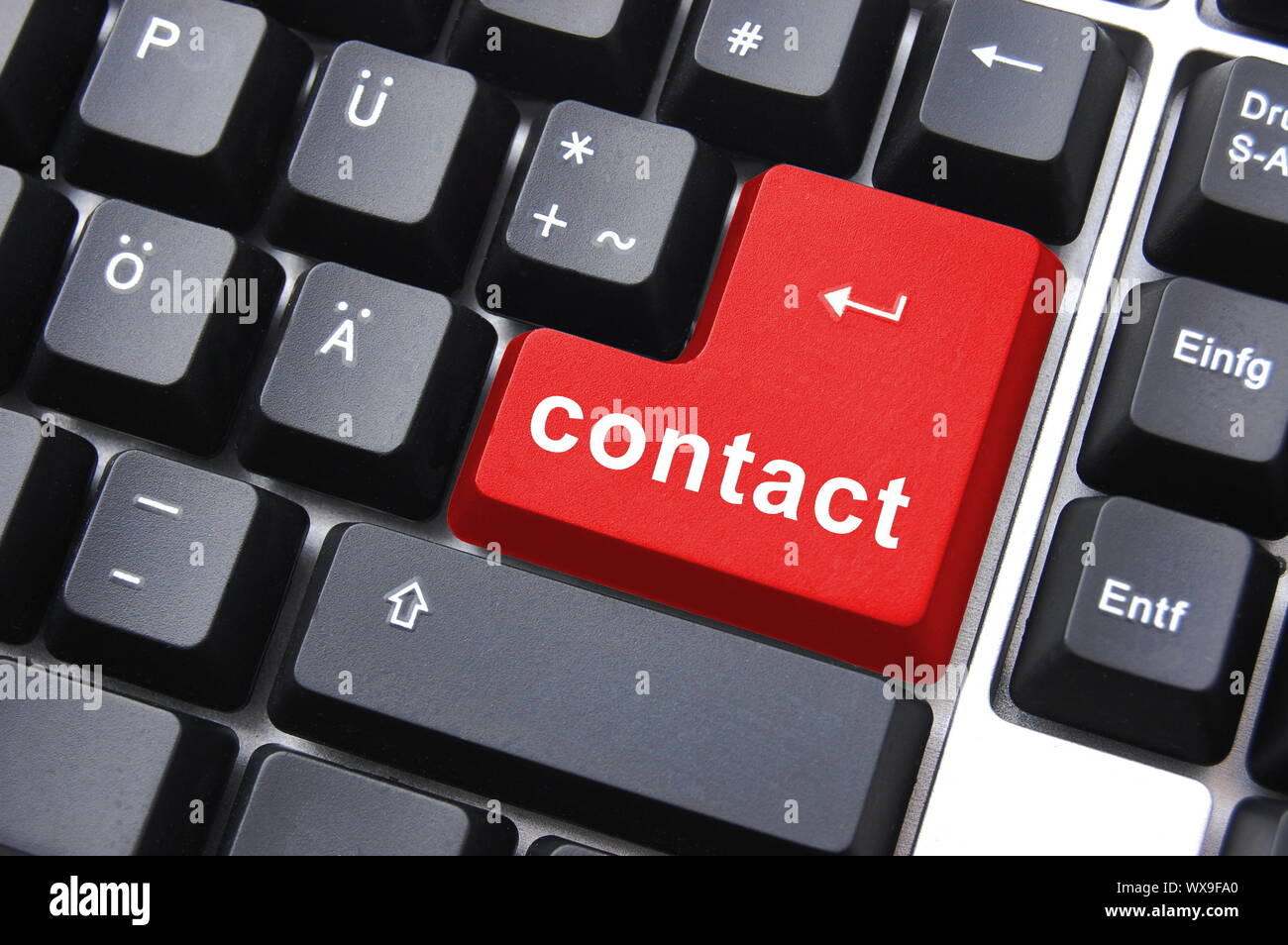 contact text written on a computer keyboard Stock Photo