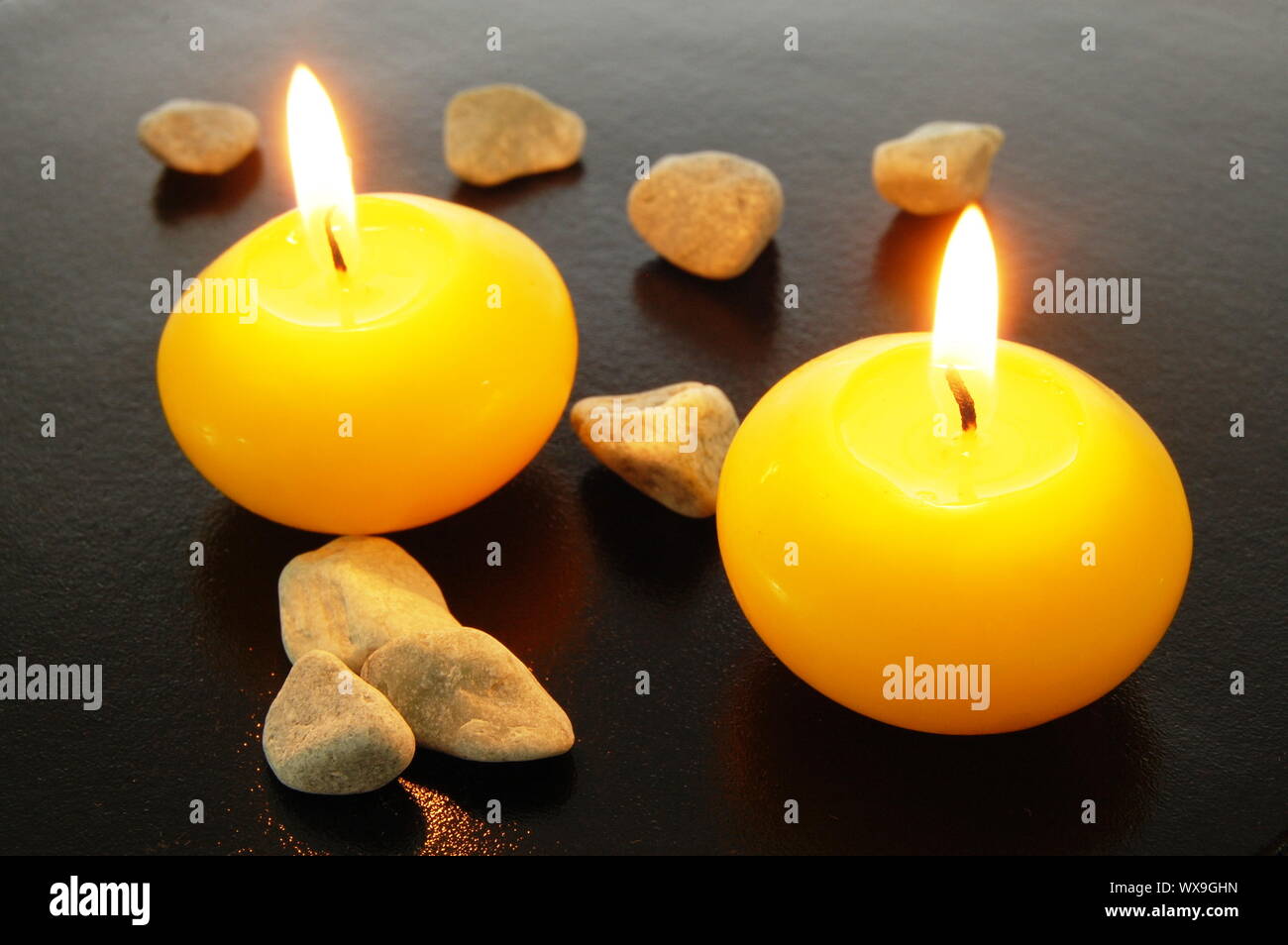 yellow candles in spa or bathroom for relaxation Stock Photo Alamy