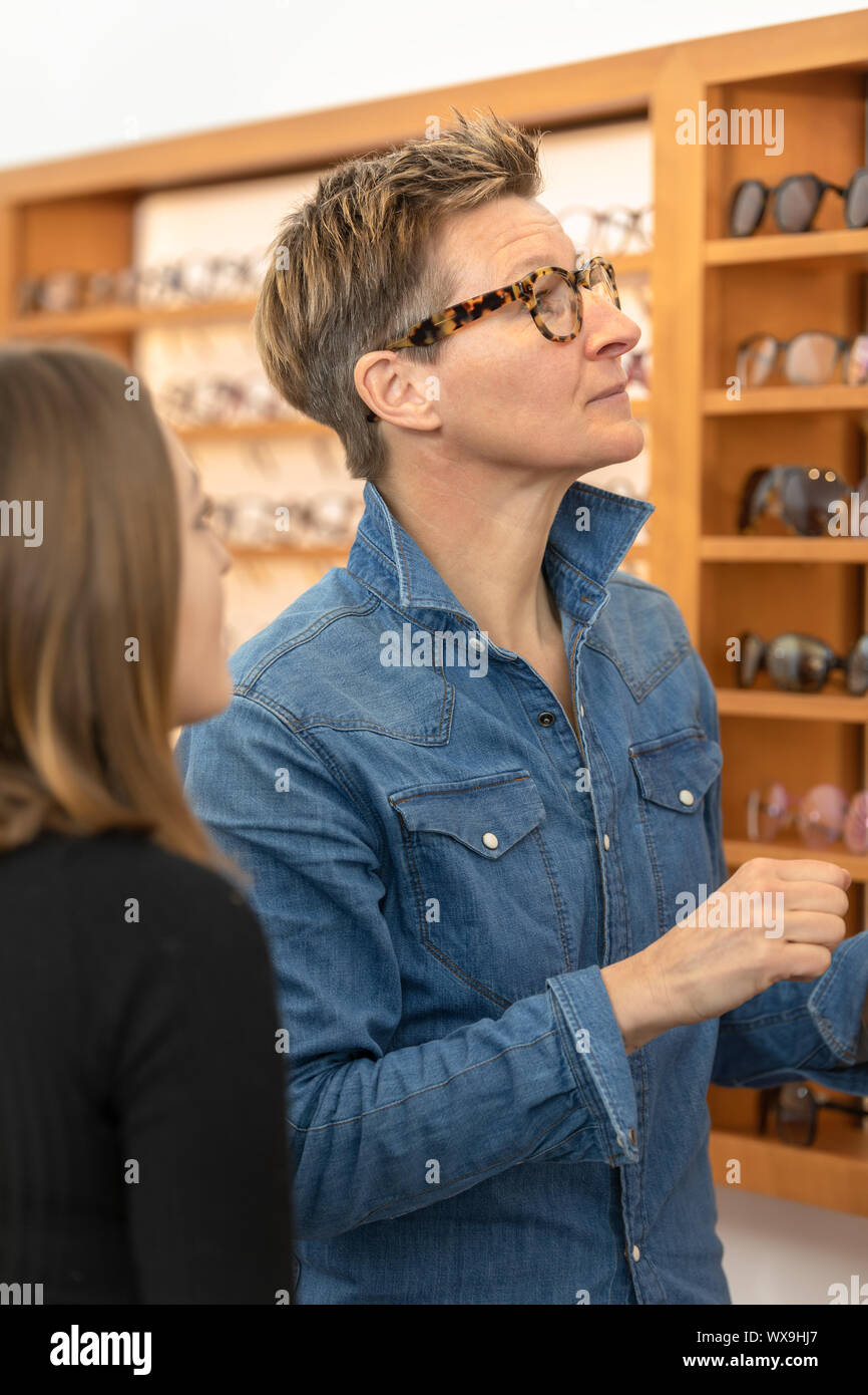 woman in a eyewear store Stock Photo